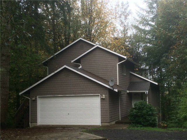 Property Photo:  7110 Camus Rd NW  WA 98502 