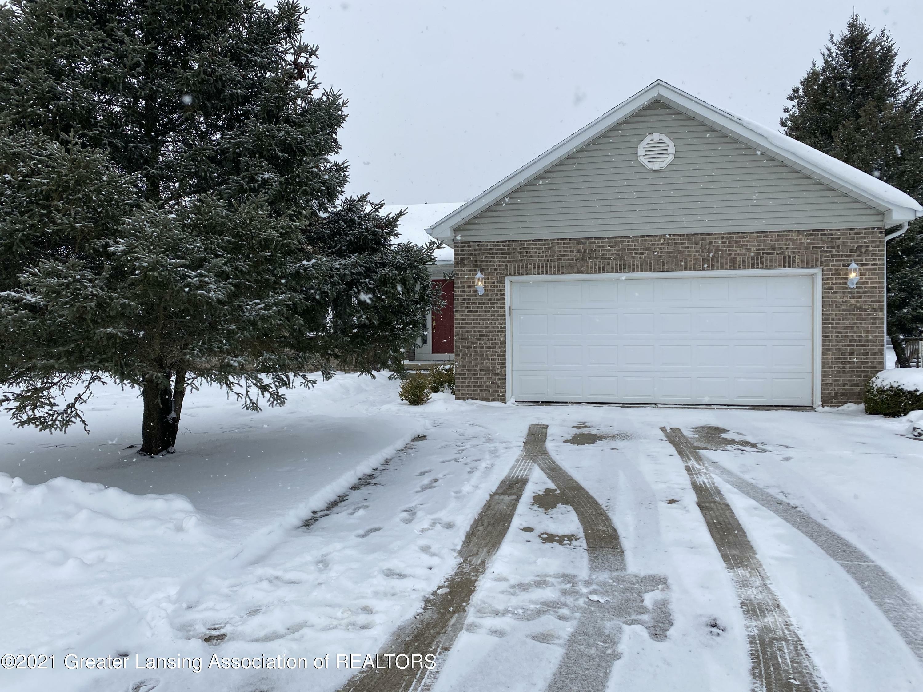 Property Photo:  604 White Pine Boulevard  MI 48917 