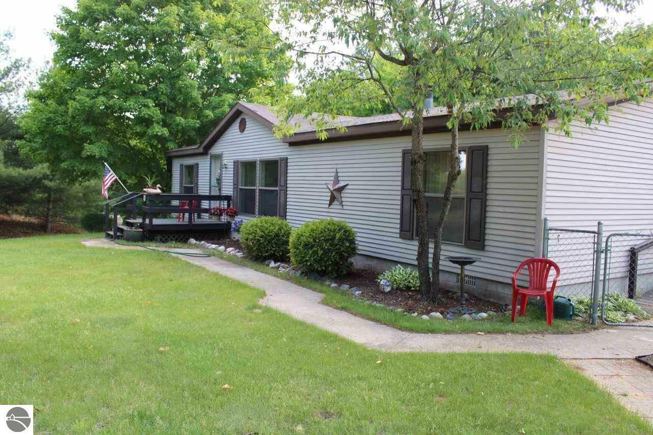 Property Photo:  8774 SE Mockerman Road  MI 49633 