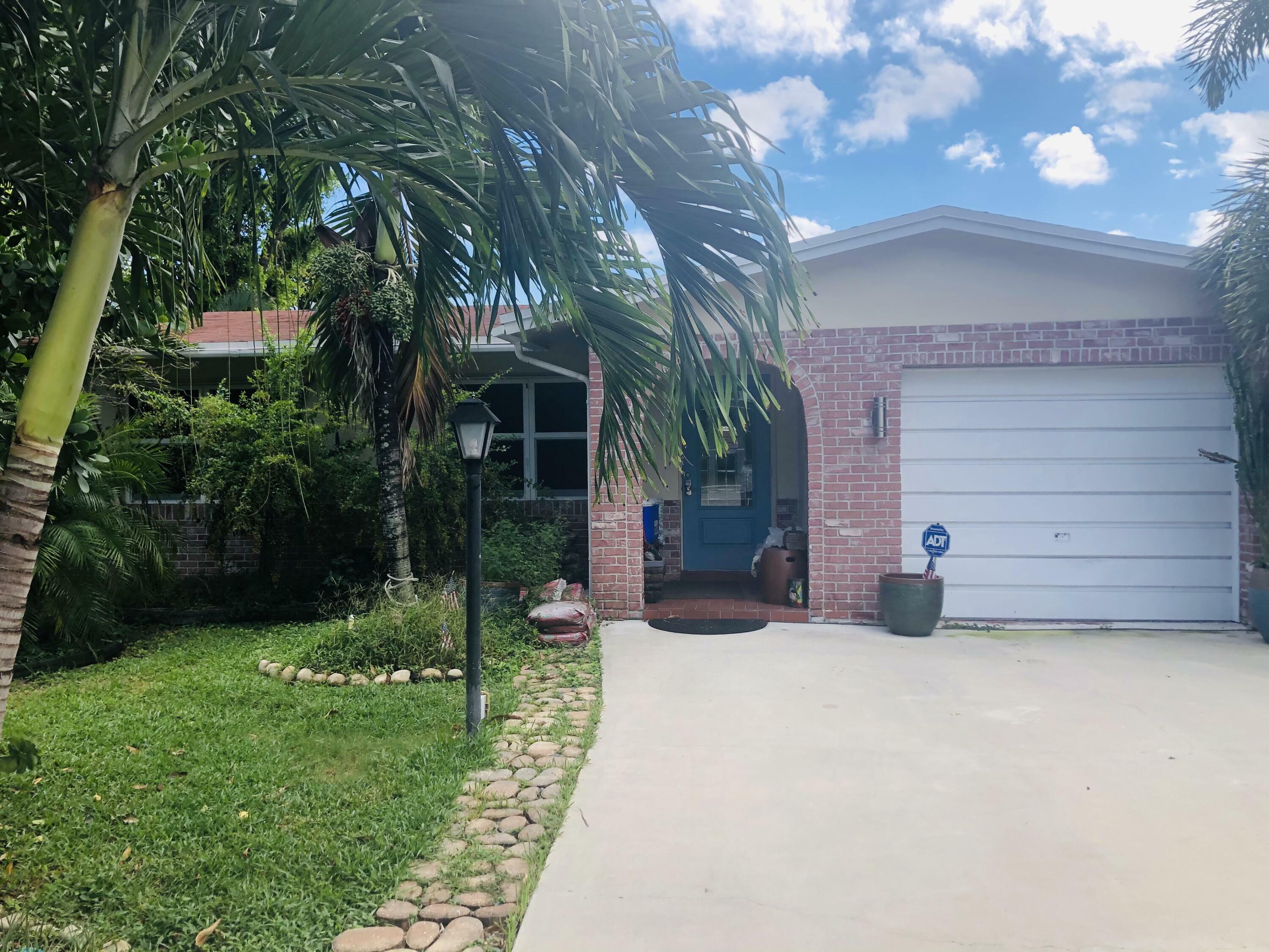 Property Photo: 910 NW 49th Court FL 33064