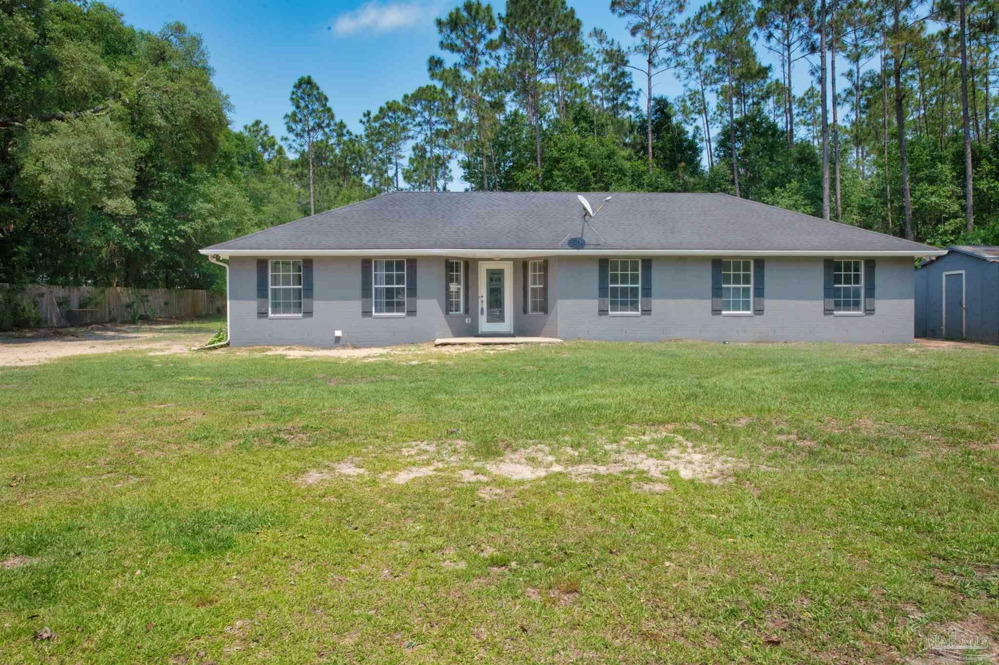 Property Photo:  5250 Black Rd  FL 32583 