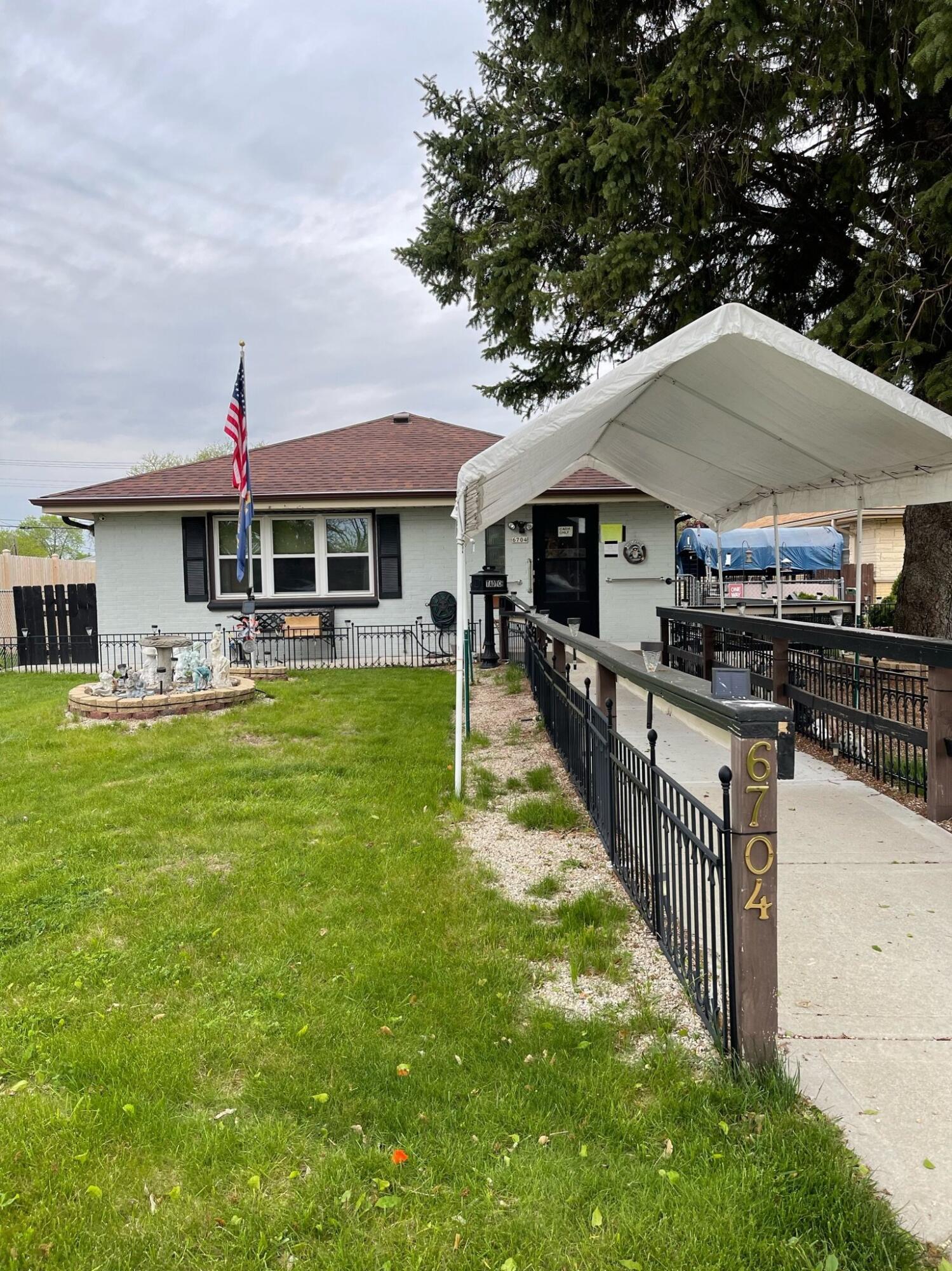 Property Photo: 6704 W Eden Pl WI 53220