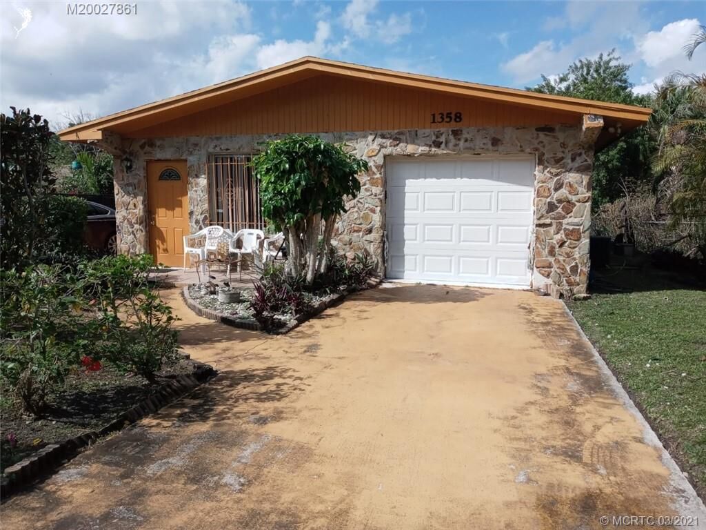 Property Photo: 1358 NW Charlie Green Drive FL 34994