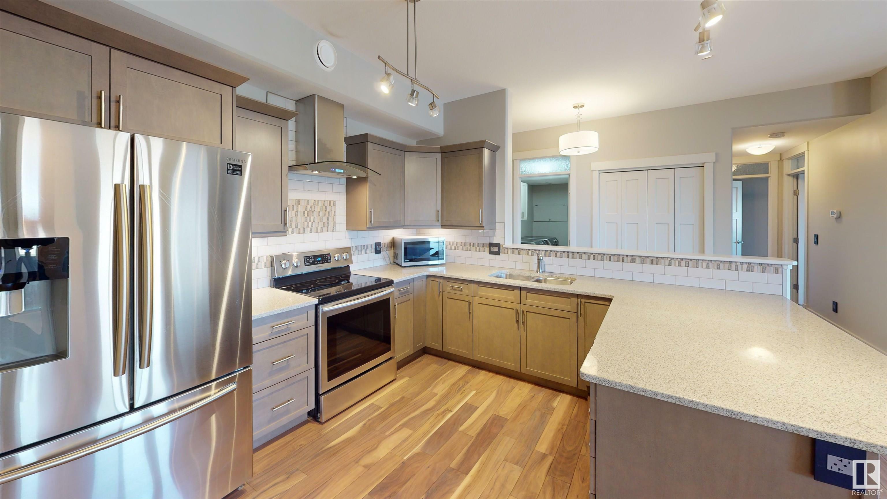 Property Photo:  5201 Brougham Drive 406  AB T7A 0C8 
