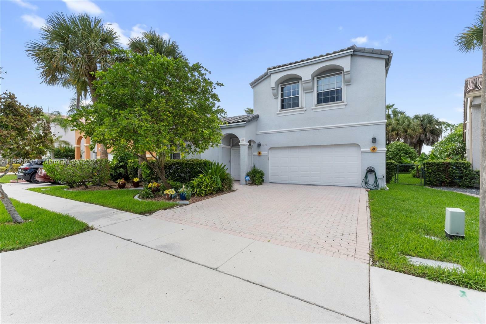 Property Photo:  611 NW 155th Ter  FL 33028 