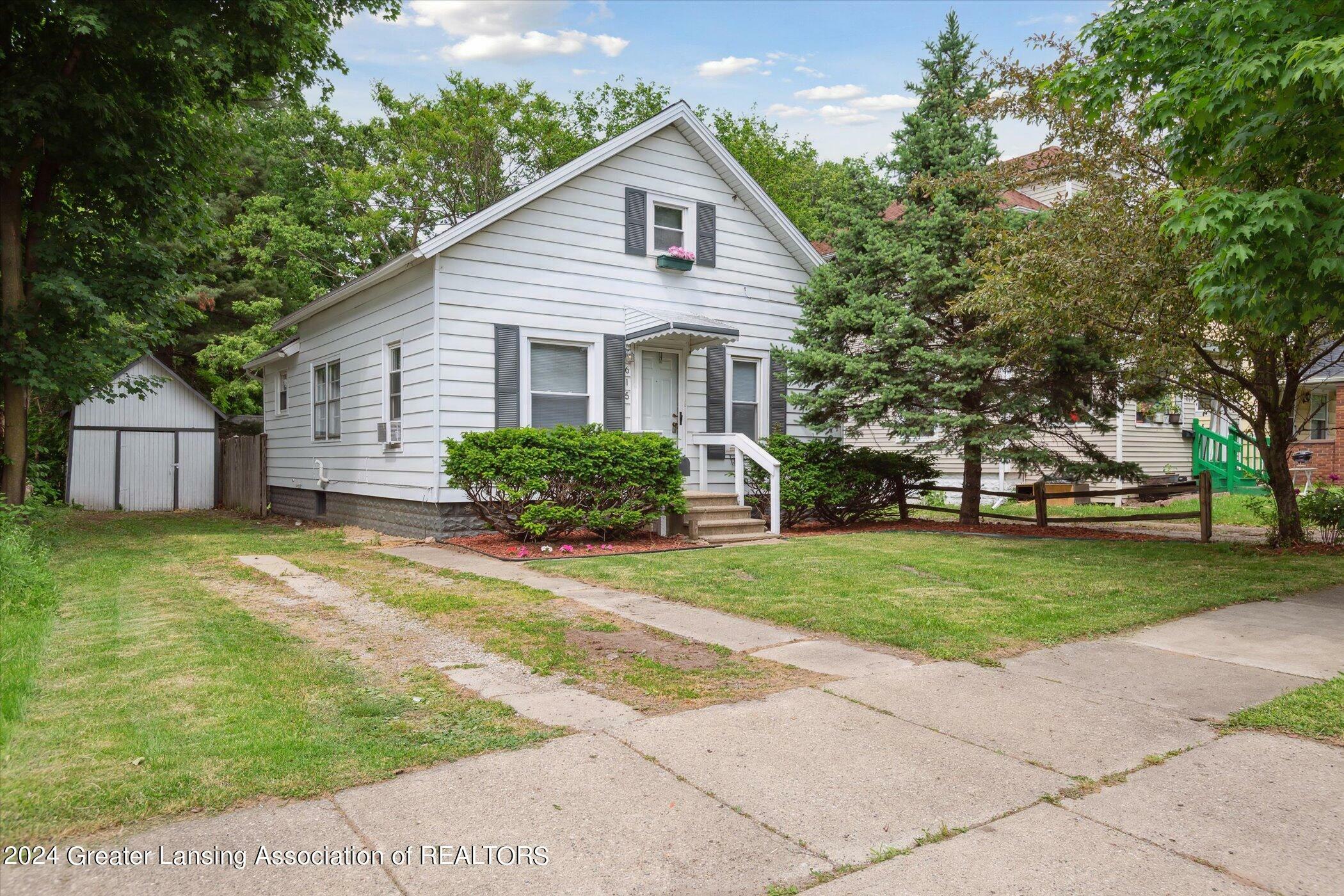 Property Photo:  615 E Mt. Hope Avenue  MI 48910 