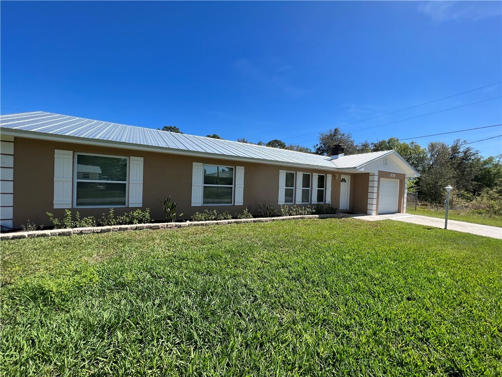 Property Photo:  879 Blossom Drive  FL 32958 