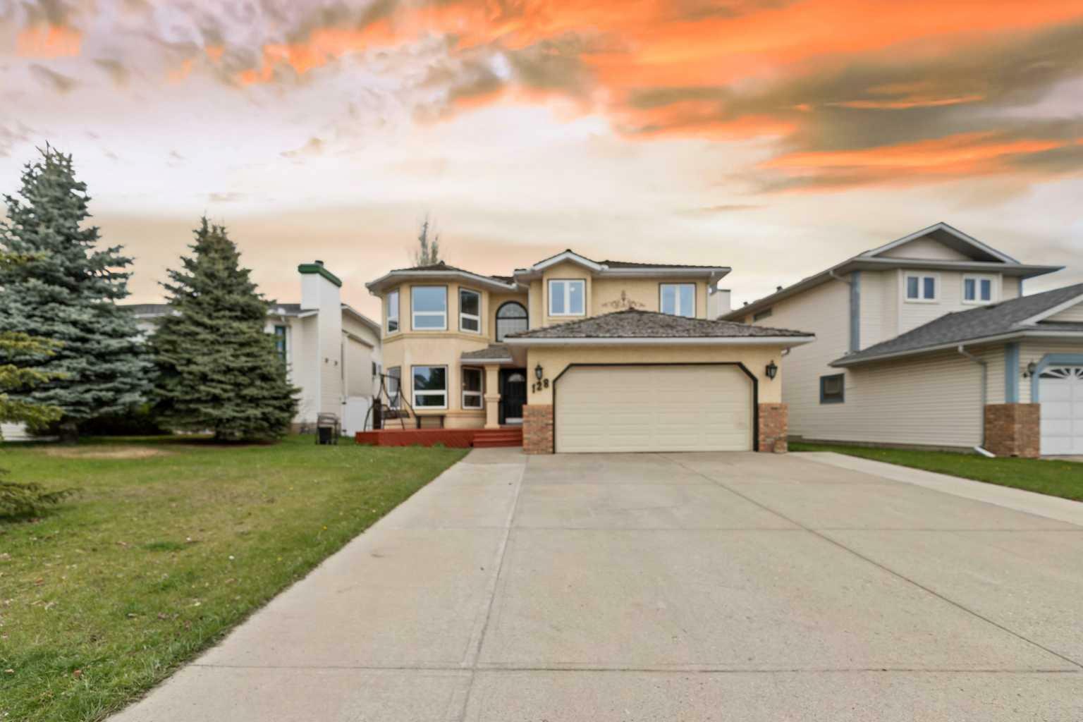 Property Photo:  128 Harvest Hills Drive NE  AB T3K 3X4 