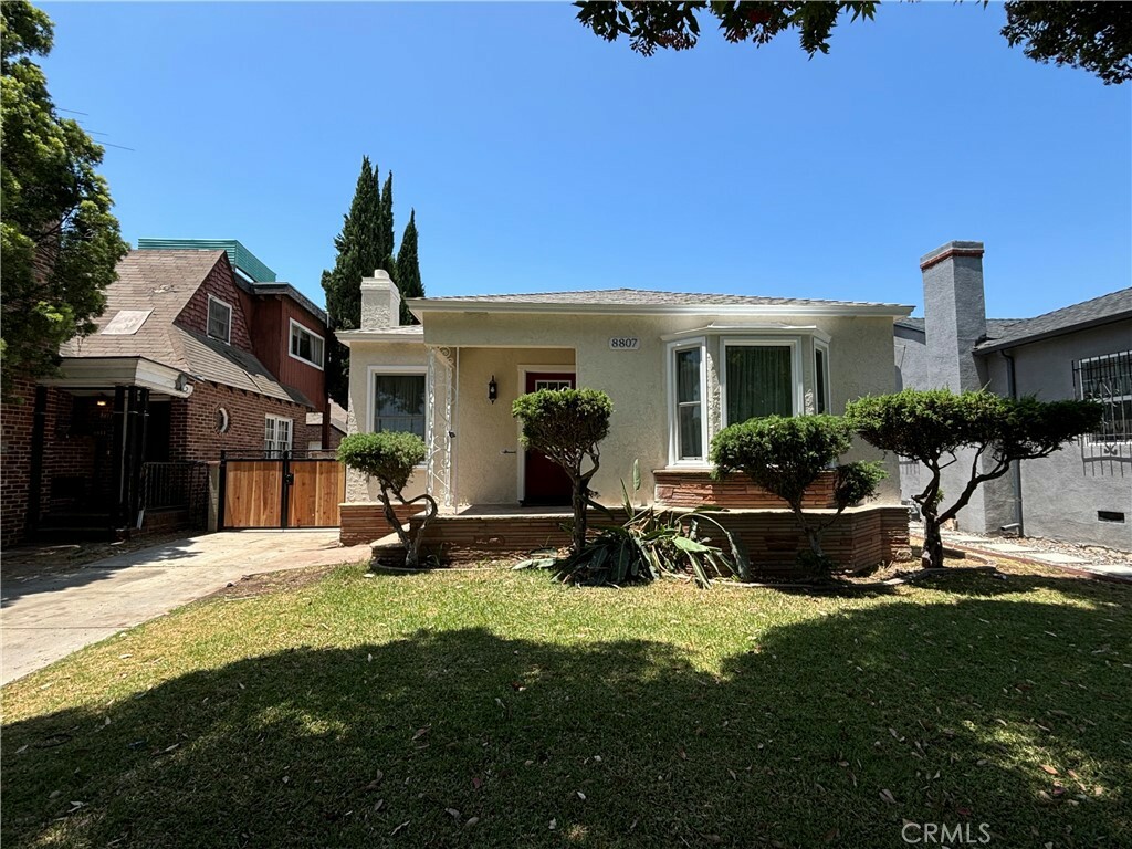 Property Photo:  8807 Cimarron Street  CA 90047 