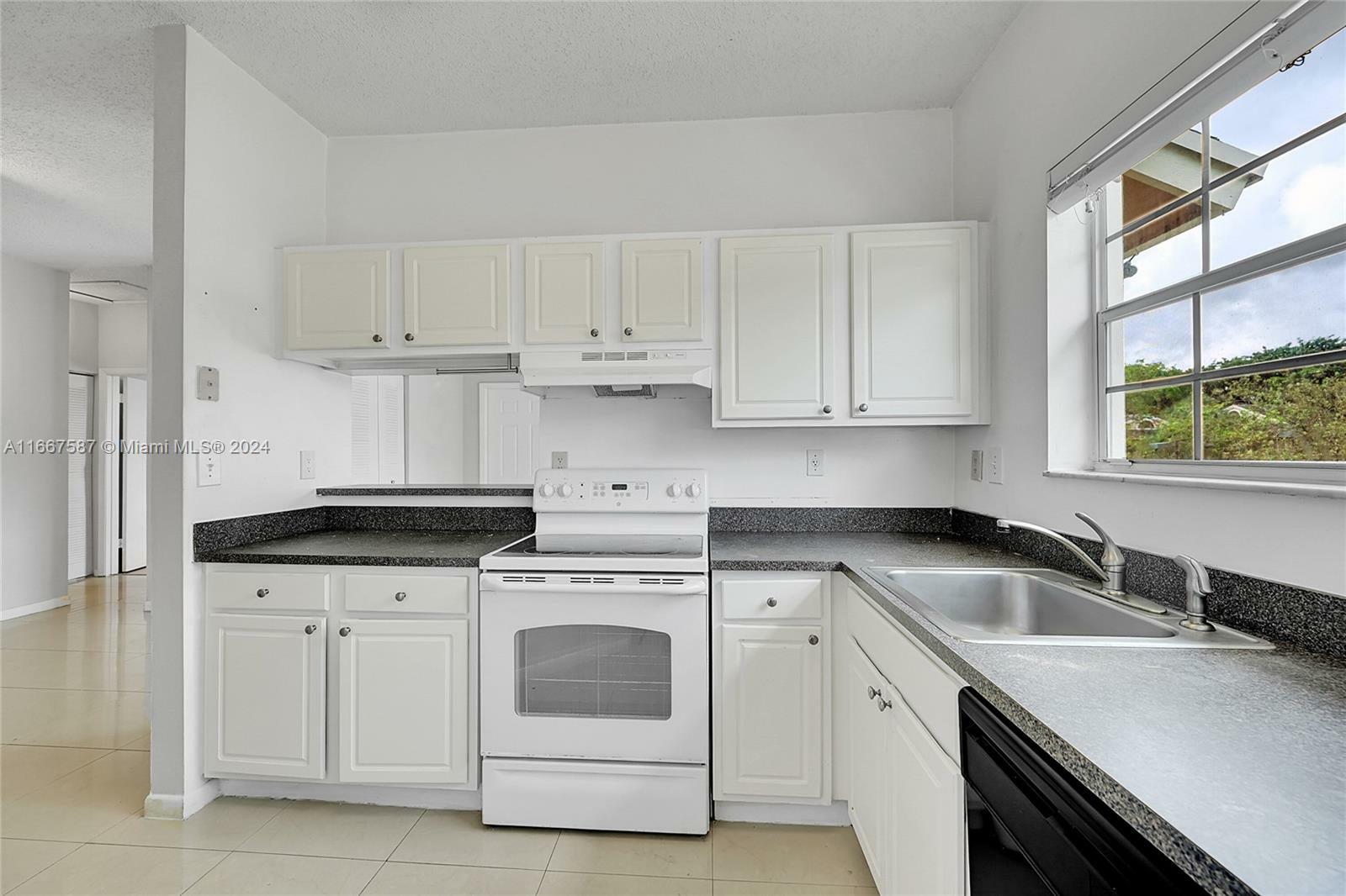 Property Photo:  1881 NW 96th Ter 7C  FL 33024 