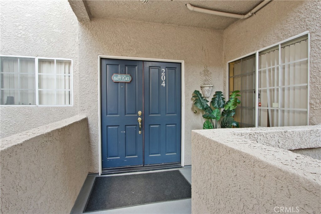 Property Photo:  4561 Warner Avenue 204  CA 92649 