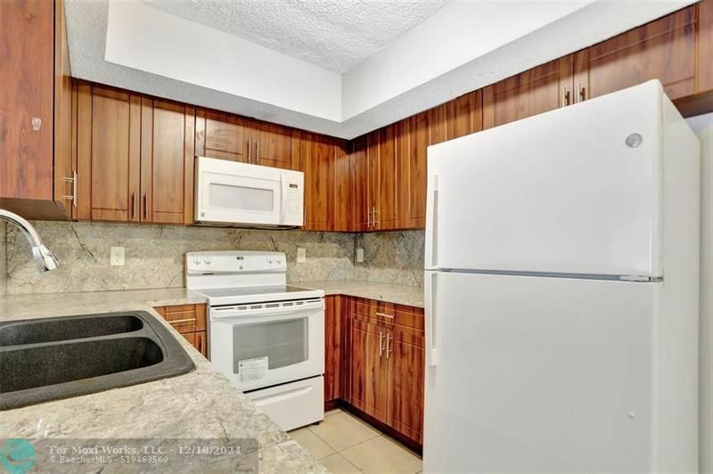 Property Photo:  5590 NW 61st St 803  FL 33073 