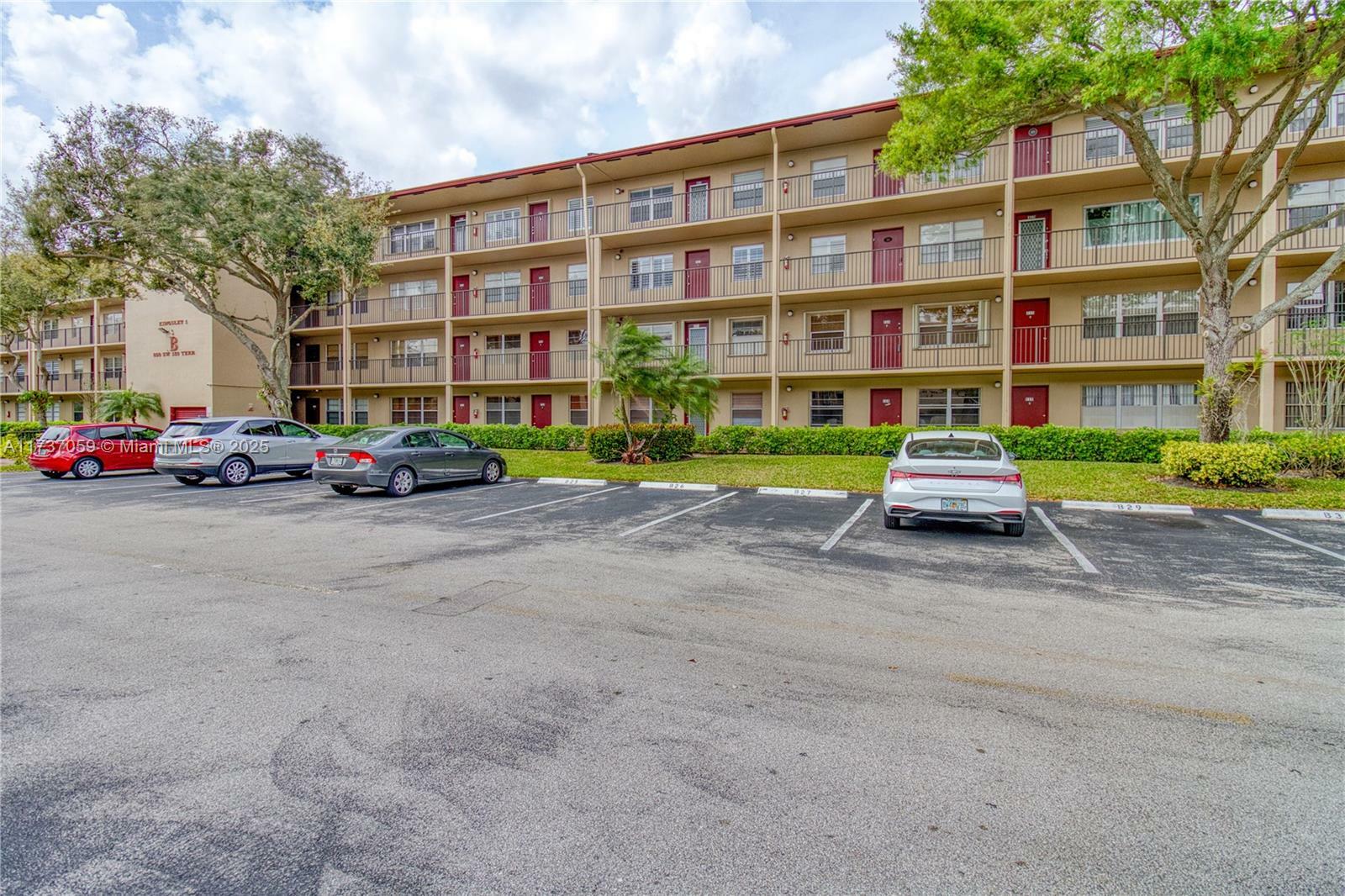 Property Photo:  850 SW 133rd Ter 213B  FL 33027 