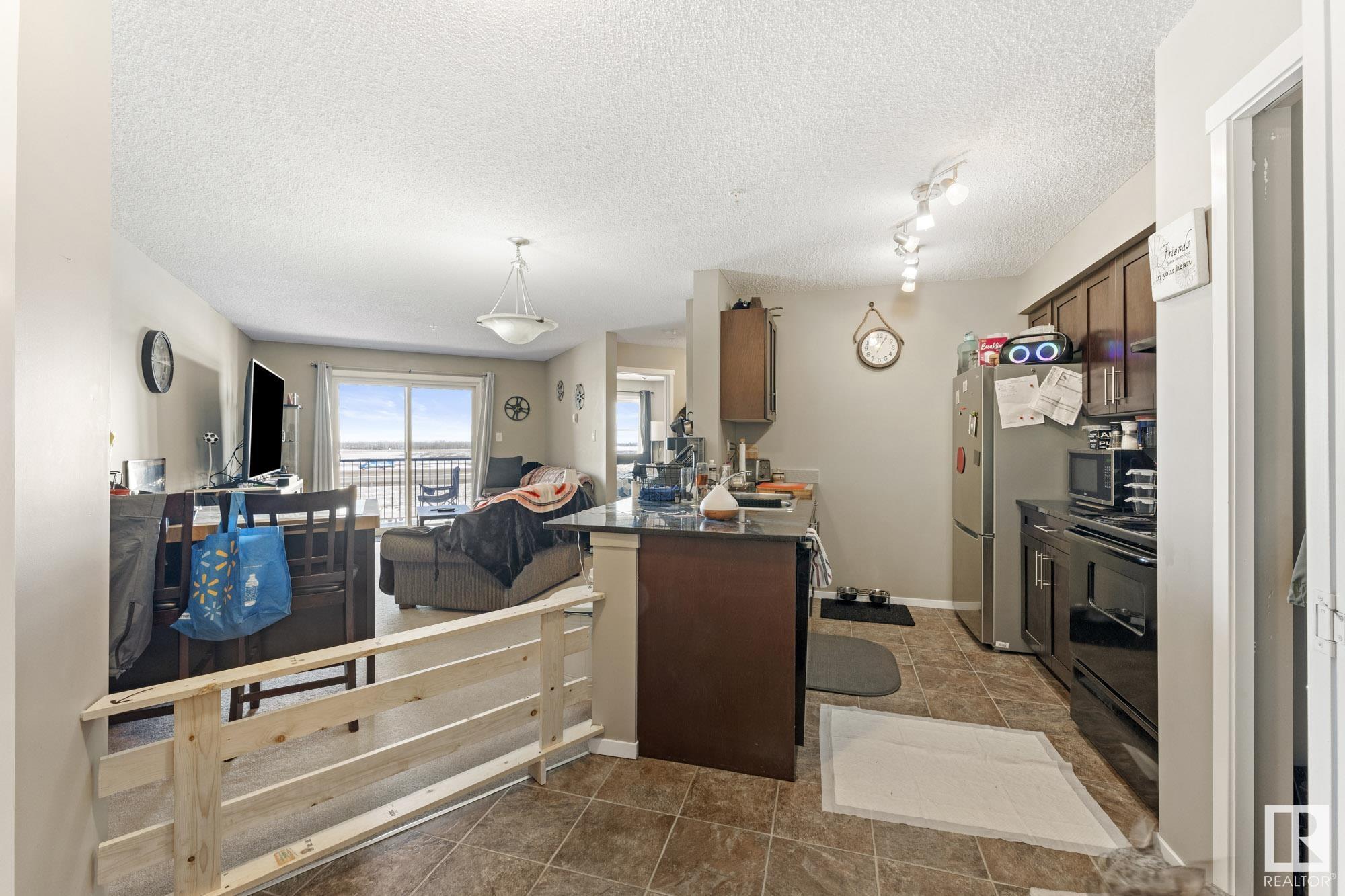 Property Photo:  18126 77 Street NW 314  AB T5Z 0N7 
