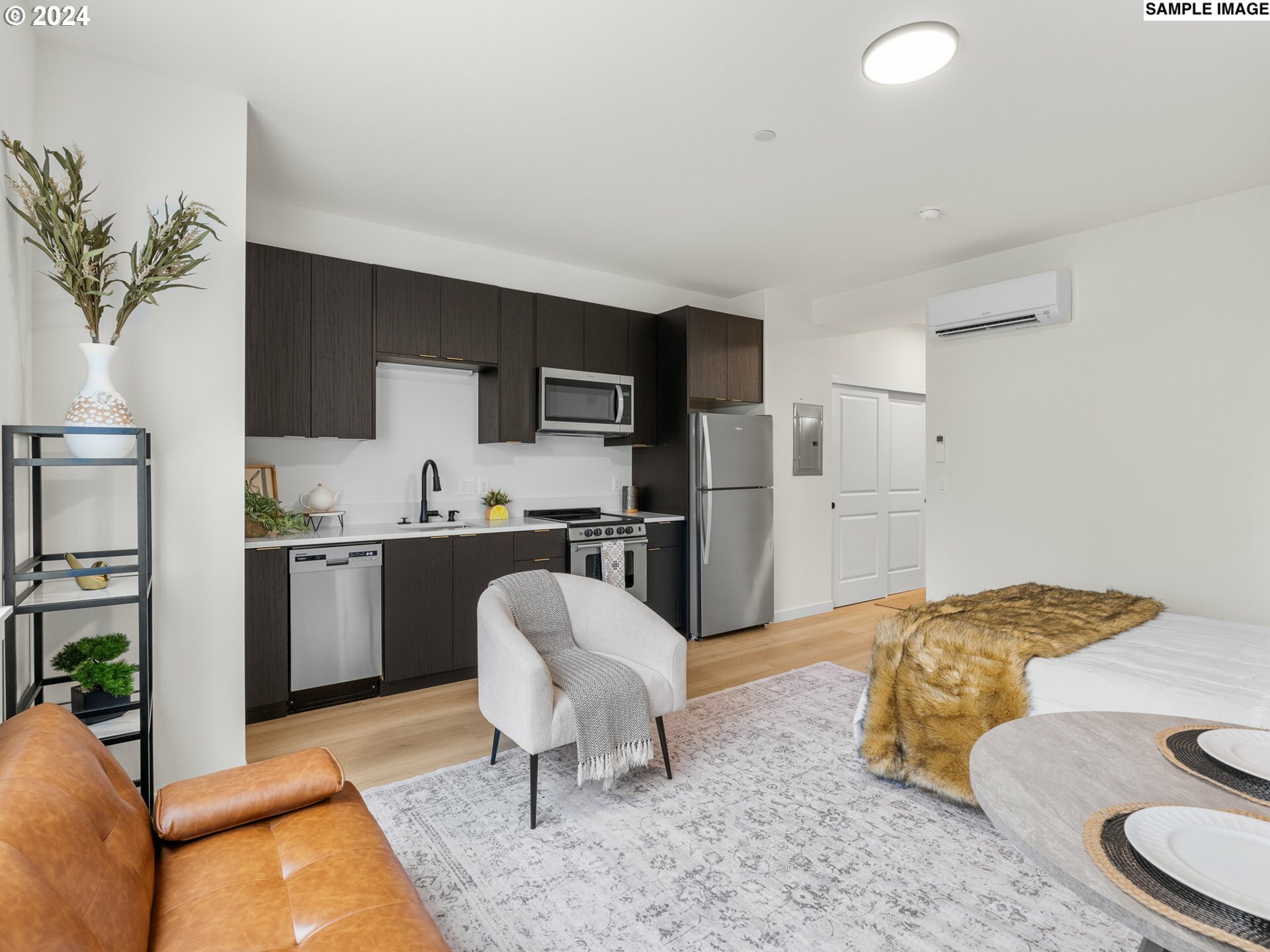 Property Photo: 10985 E Burnside St 26 OR 97216
