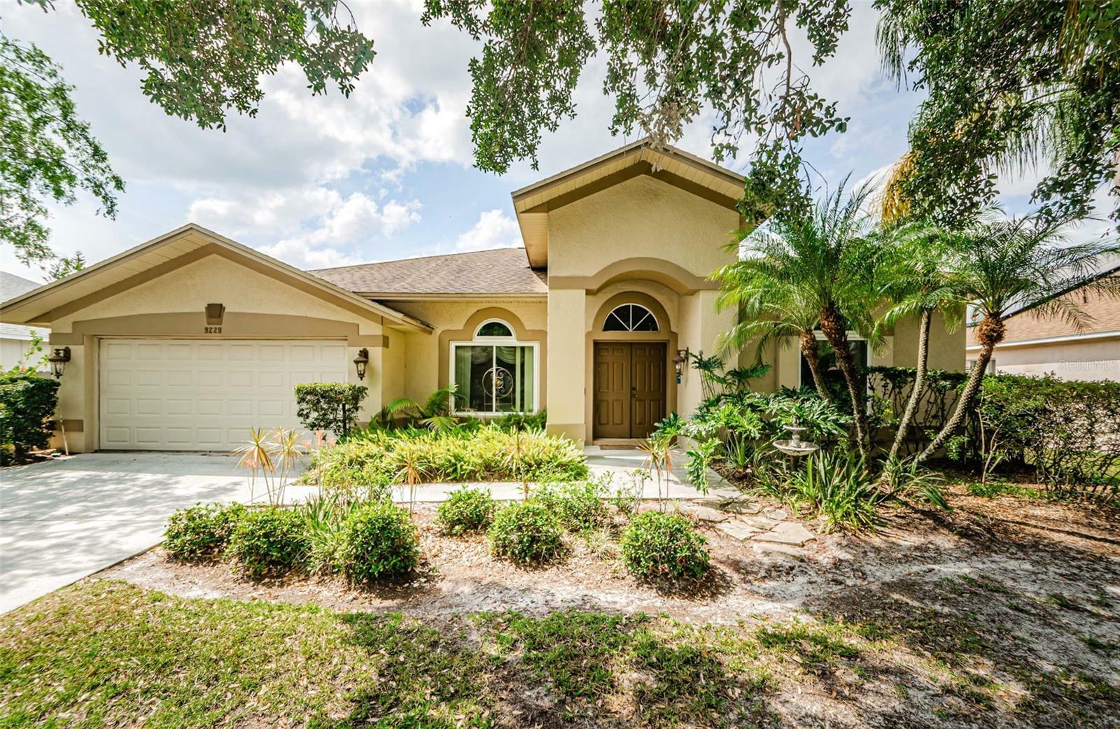 Property Photo: 9229 Dayflower Drive FL 33647