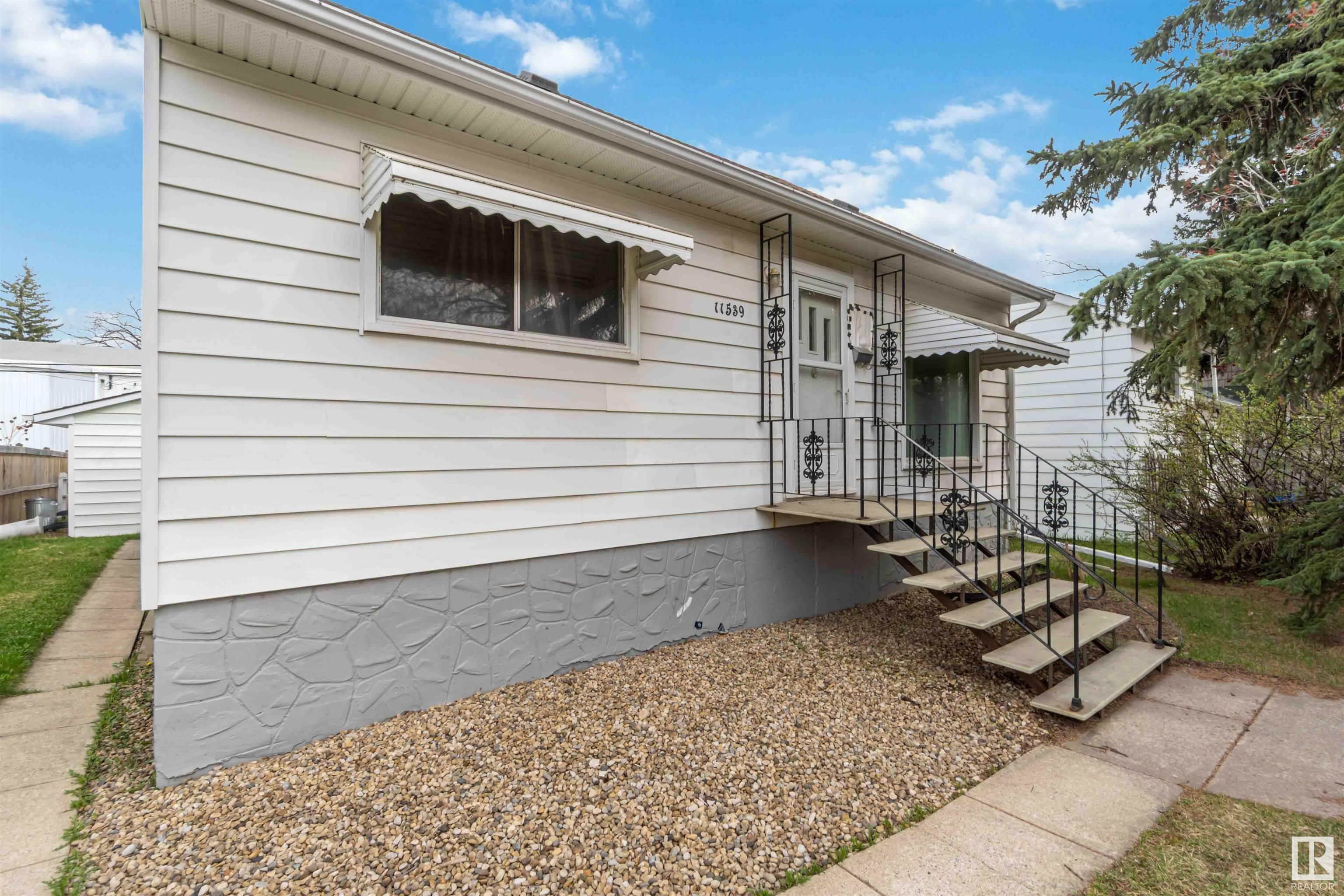 Property Photo: 11539 St Albert Trail NW AB T5M 3L4