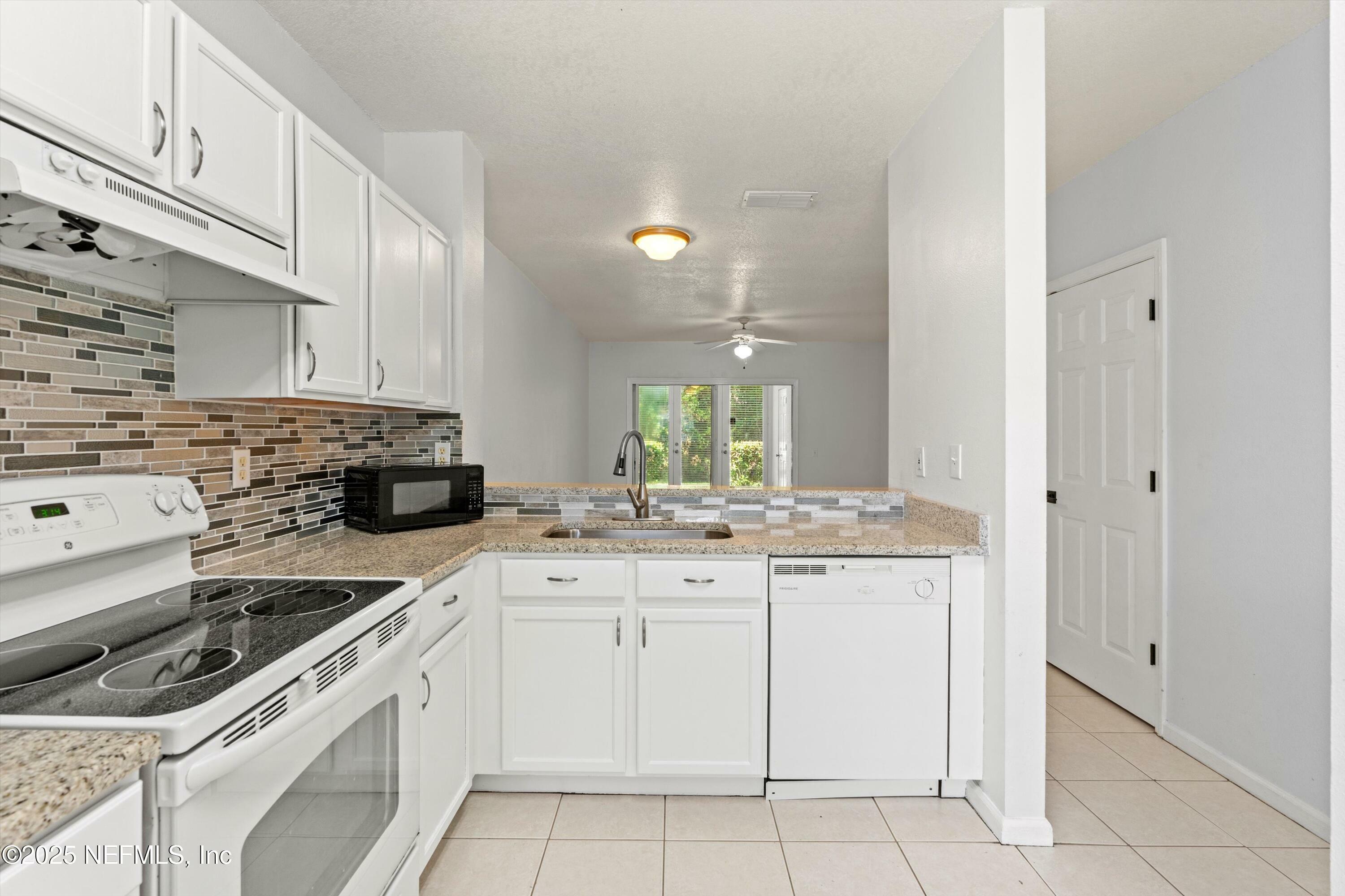 Property Photo: 12311 Kensington Lakes Drive 1003 FL 32246