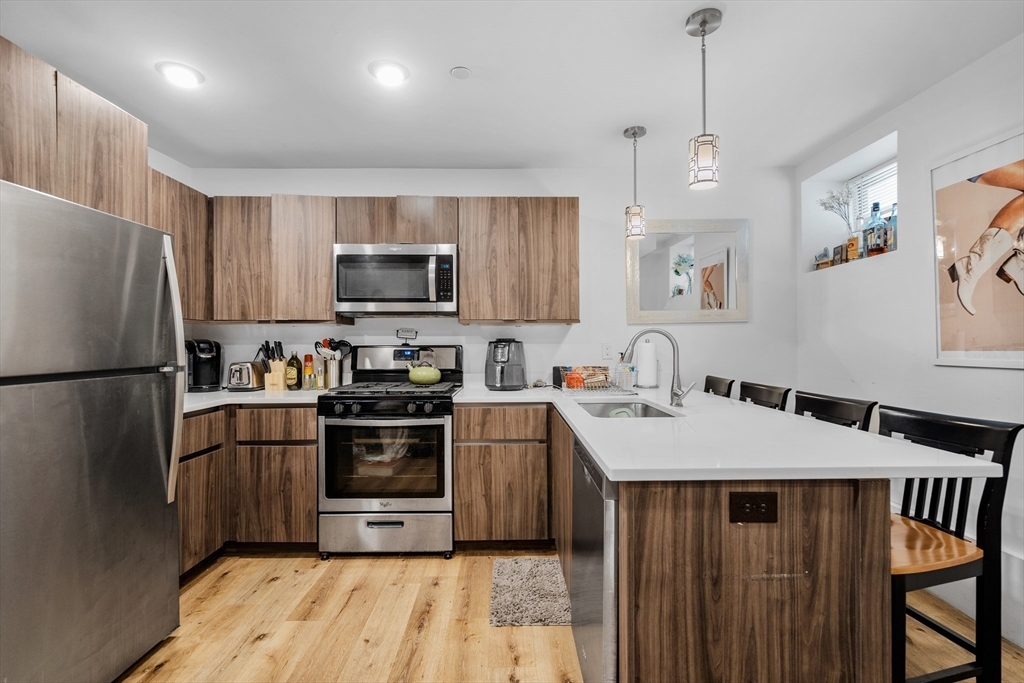 Property Photo: 211 W 9th St. 1 MA 02127