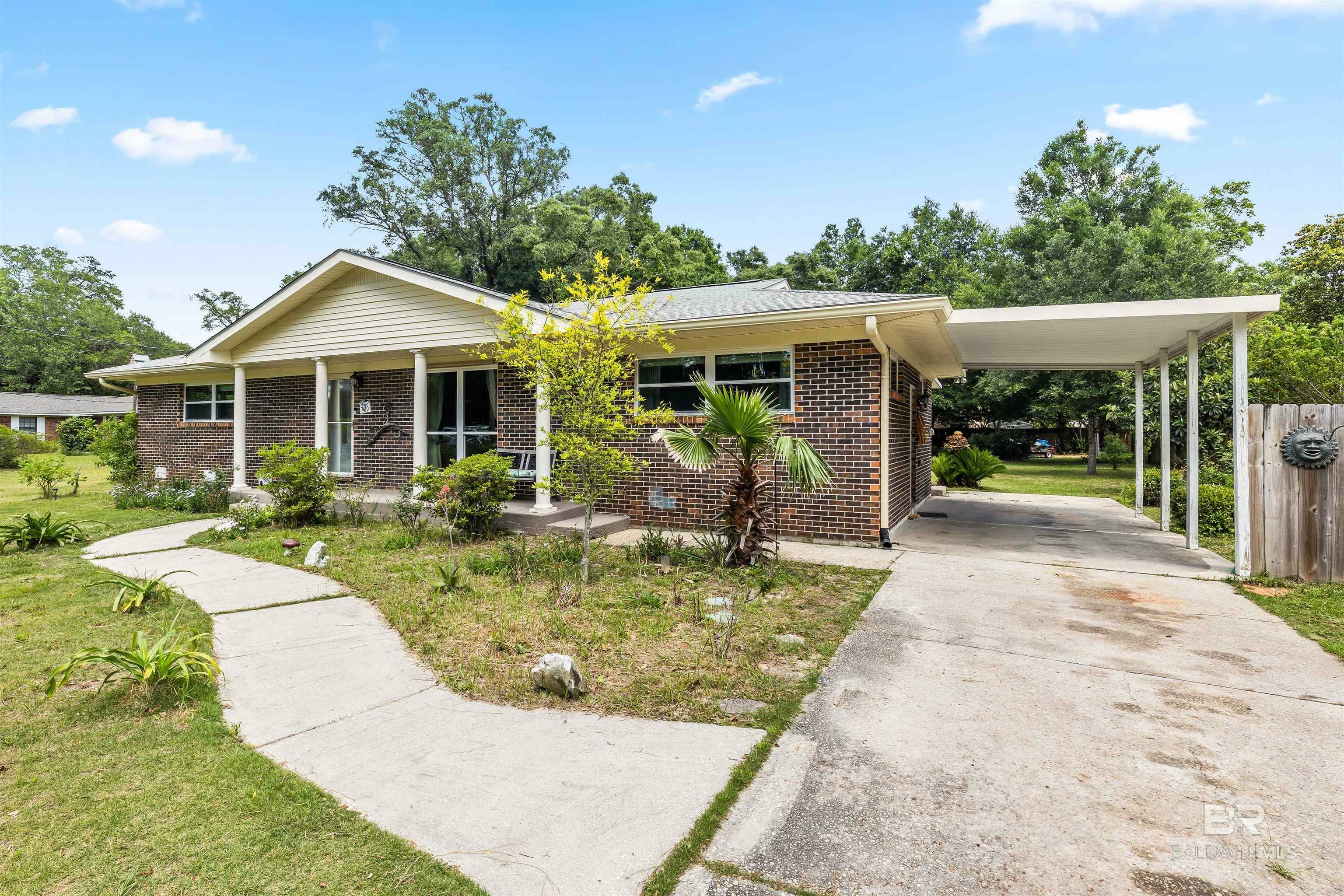 Property Photo: 7410 Helton Drive AL 36535