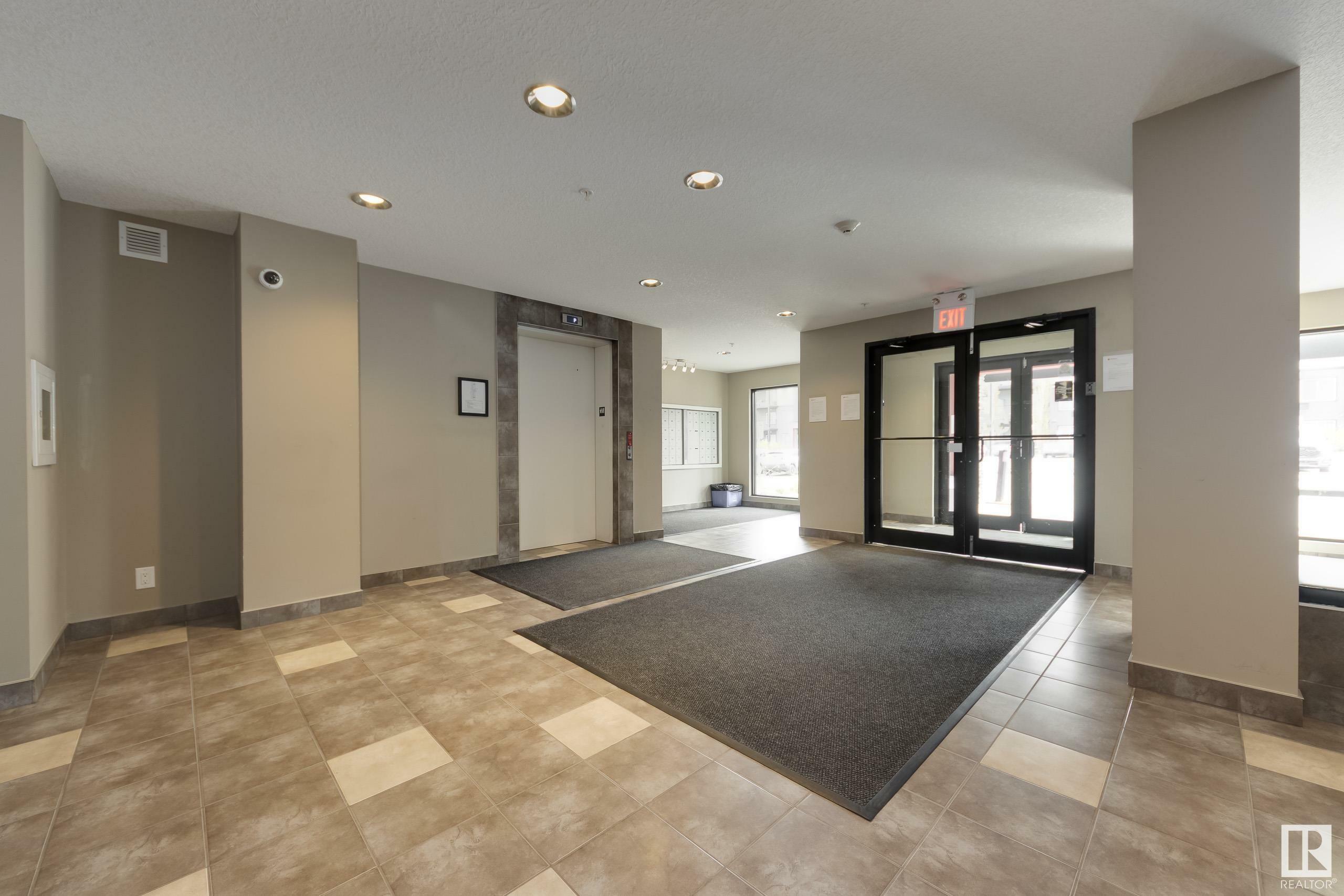 Property Photo: 5521 7 Avenue SW 206 AB T6X 2A8