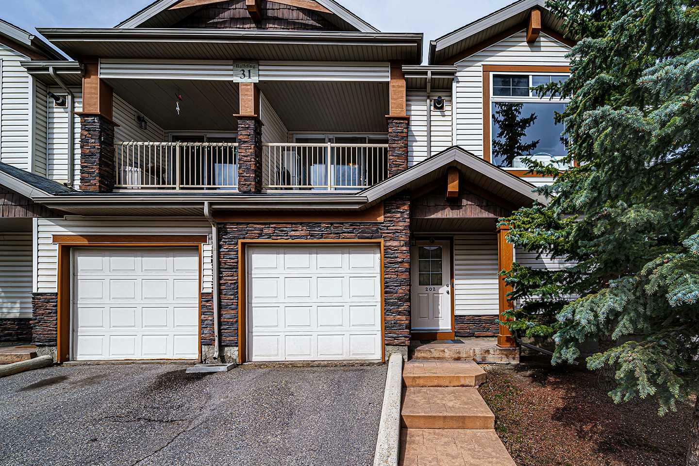 Property Photo: 31 Panatella Landing NW 202 AB T3K 0J7