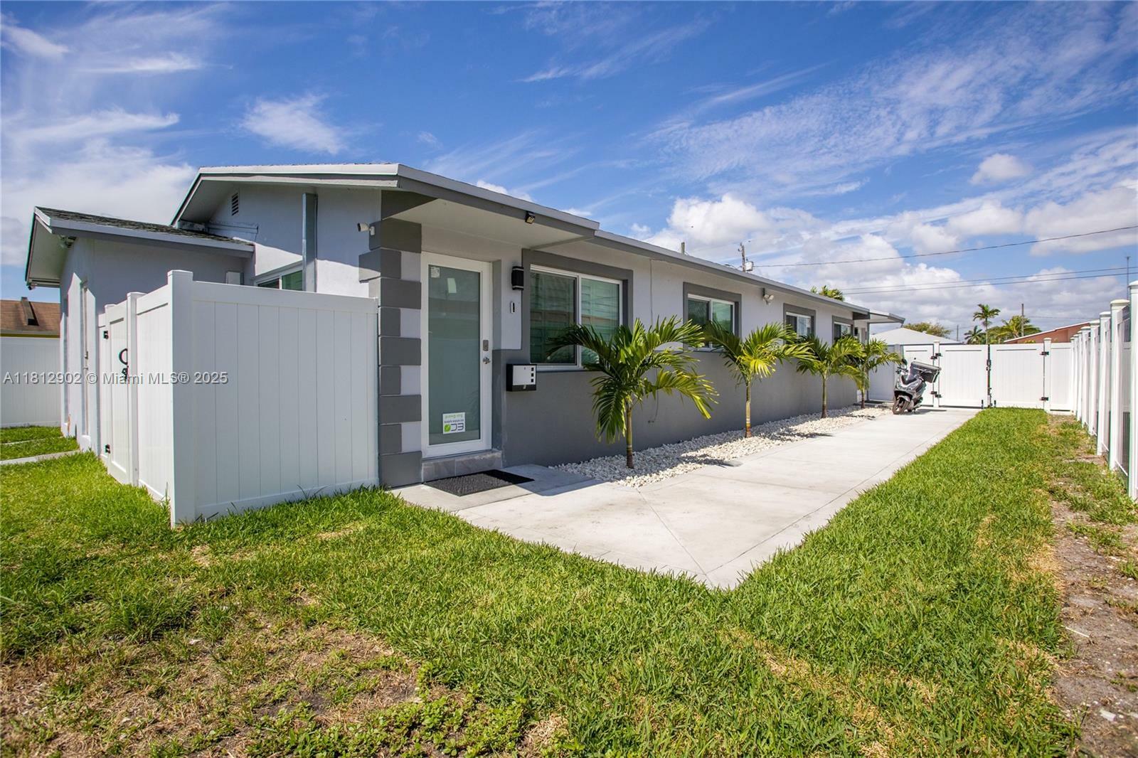 Property Photo:  608 NW 4th Ave A  FL 33009 