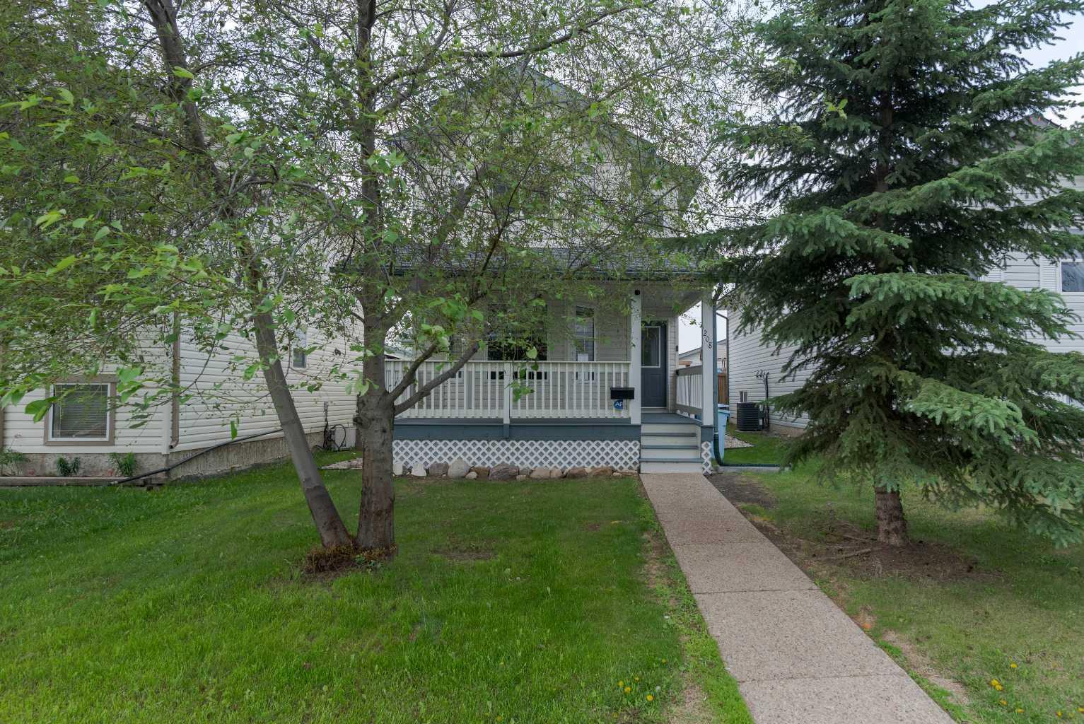 Property Photo: 208 Diefenbaker Drive AB T9K 2J9