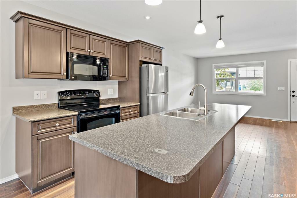 Property Photo: 212 Langlois Way SK S7T 0L2