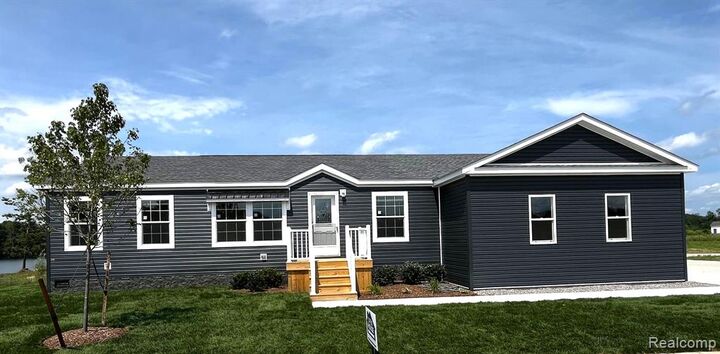 Property Photo: 202 Riviera Drive MI 48446