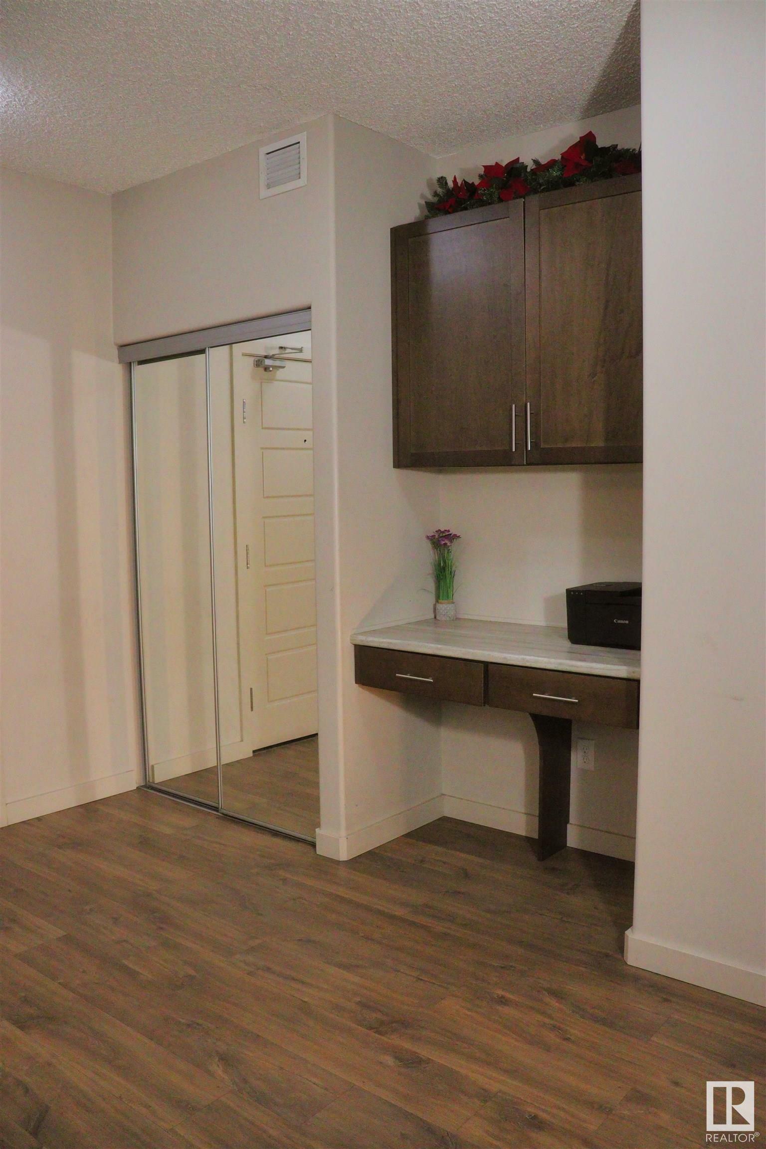 Property Photo: 1144 Adamson Drive SW 110 AB T6W 2X7
