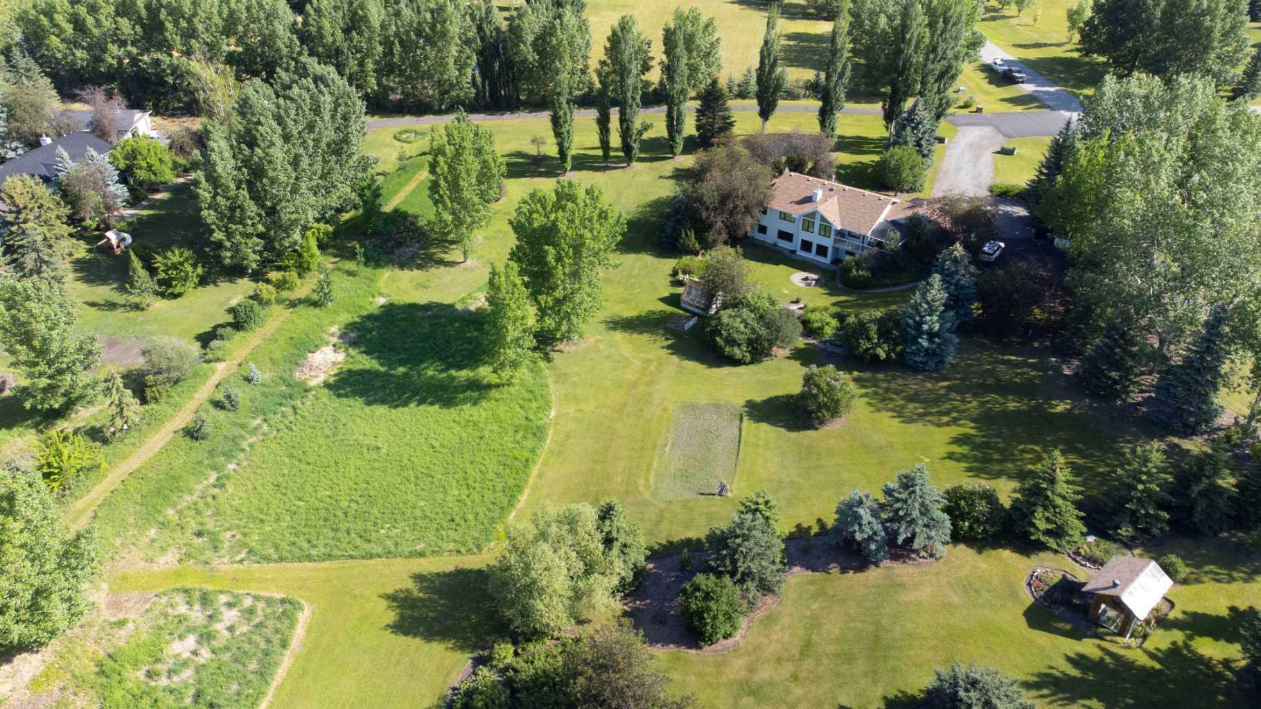 Property Photo: 80057 Highwood Meadows Drive E AB T1S 4Y9