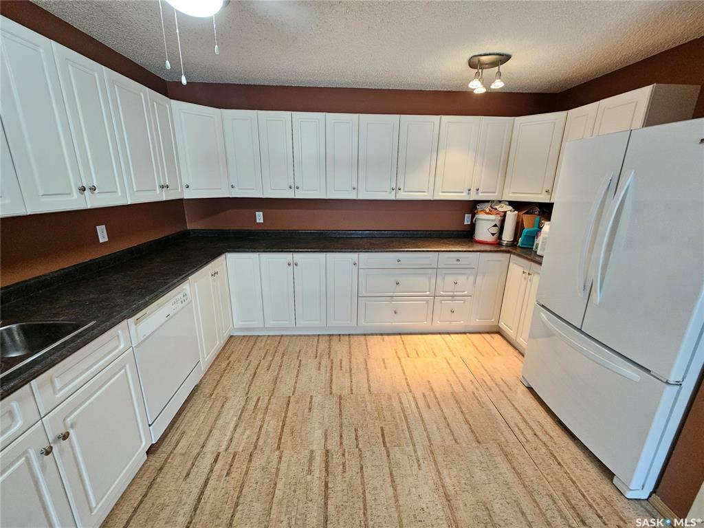 Property Photo: 55 Wood Lily Drive 204 SK S6J 1H1