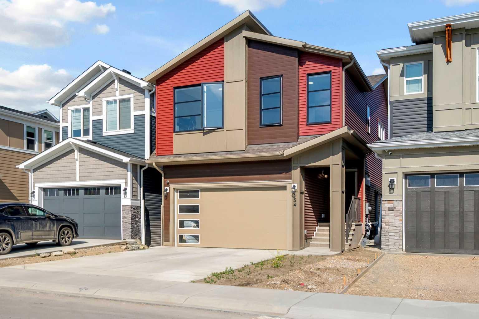 Property Photo: 154 Silver Spruce Grove SW AB T2X 5M2