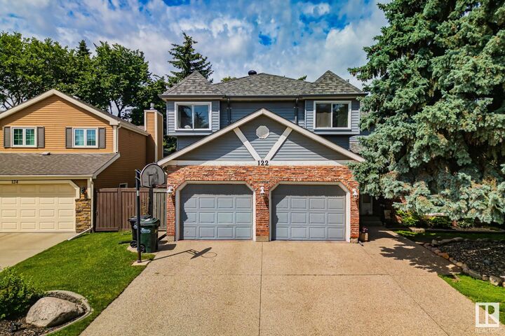 Property Photo:  122 Village Downs  AB T8A 4L6 