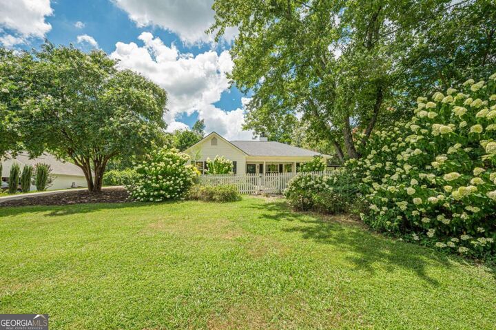 Property Photo:  7820 Silversmith Drive  GA 30028 