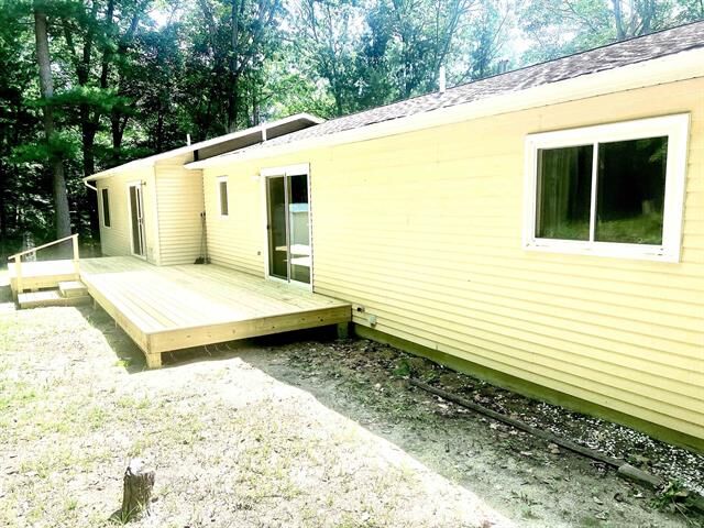 Property Photo:  315 Timber Hill  MI 49696 