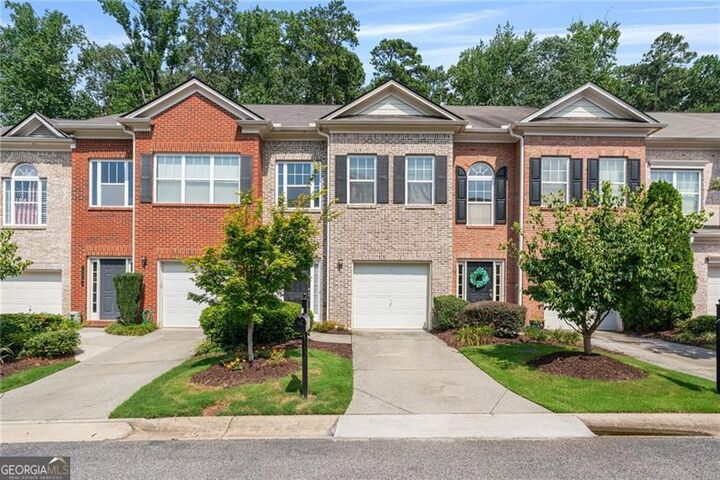 Property Photo:  1030 Firethorne Pass  GA 30040 