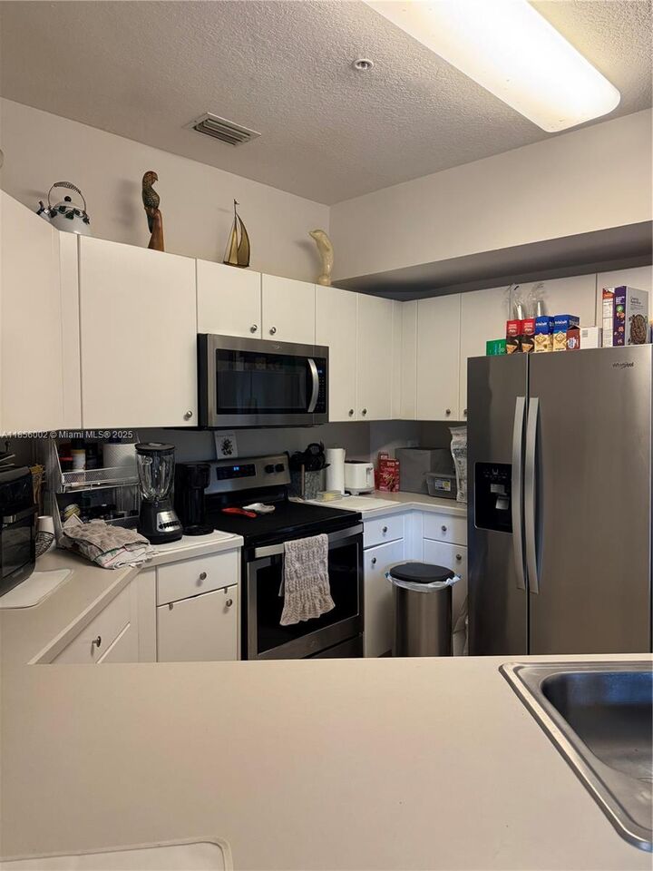 Property Photo: 5650 NW 115th Ct 104 FL 33178