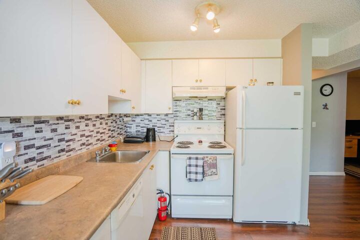 Property Photo:  1620 70 Street SE 4112  AB T2A 7Z3 