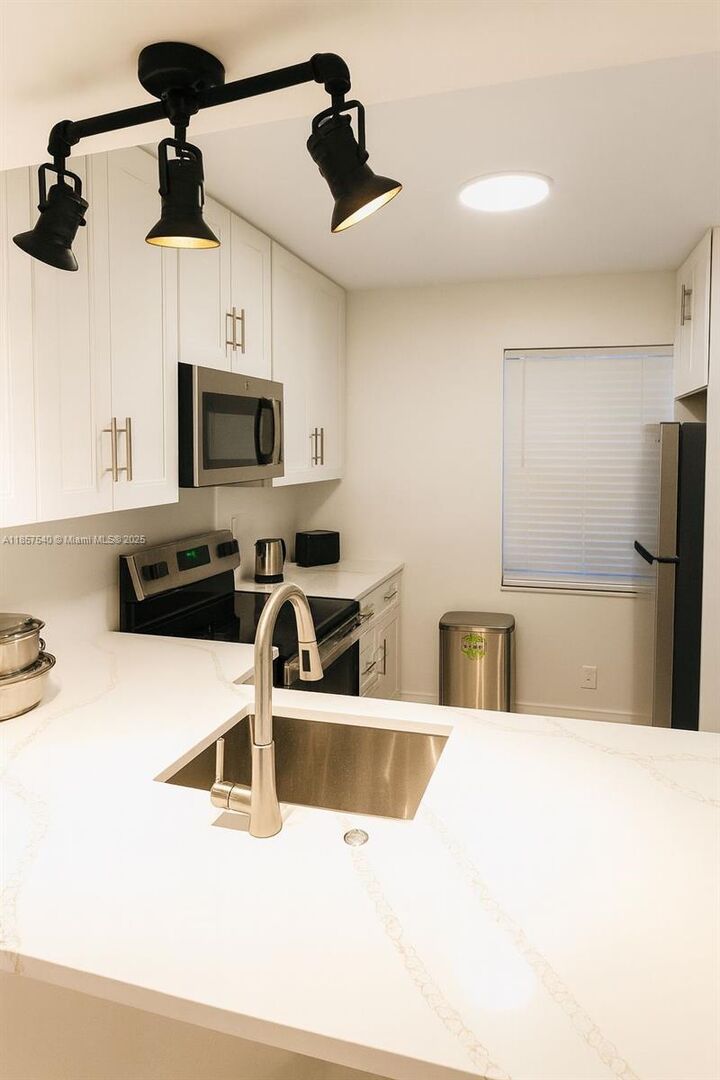Property Photo:  10501 W Broward Blvd 303  FL 33324 