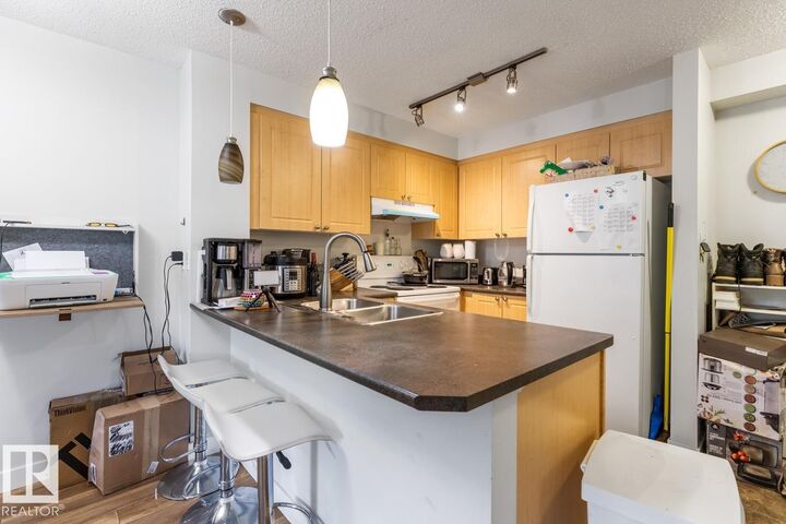Property Photo: 622 McAllister Loop SW 213 AB T6W 1N2