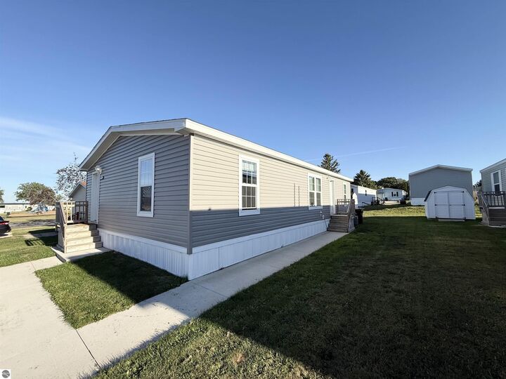 Property Photo:  1114 Peachtree Court  MI 48858 