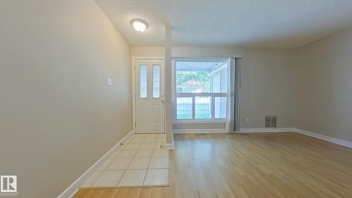 Property Photo: 2703 79 Street NW 9 AB T6K 3Z6