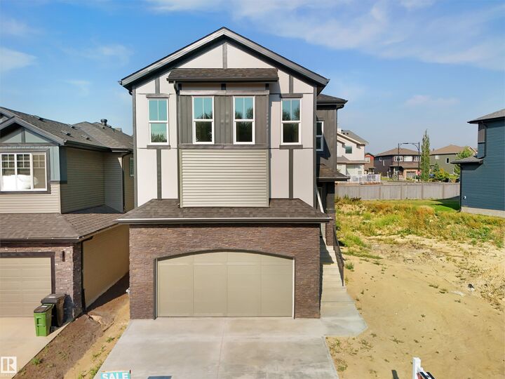 Property Photo: 1142 Gyrfalcon Crescent NW AB T5S 0S5