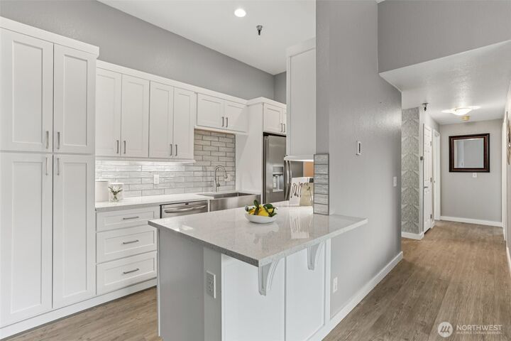 Property Photo:  1100  Harrington Ave NE 306  WA 98056 