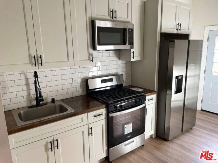 Property Photo:  9712 S San Pedro St  CA 90003 