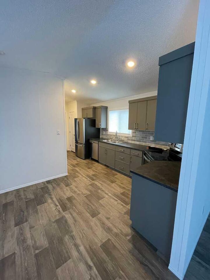 Property Photo: 140 Caouette Crescent AB T9K 2H5