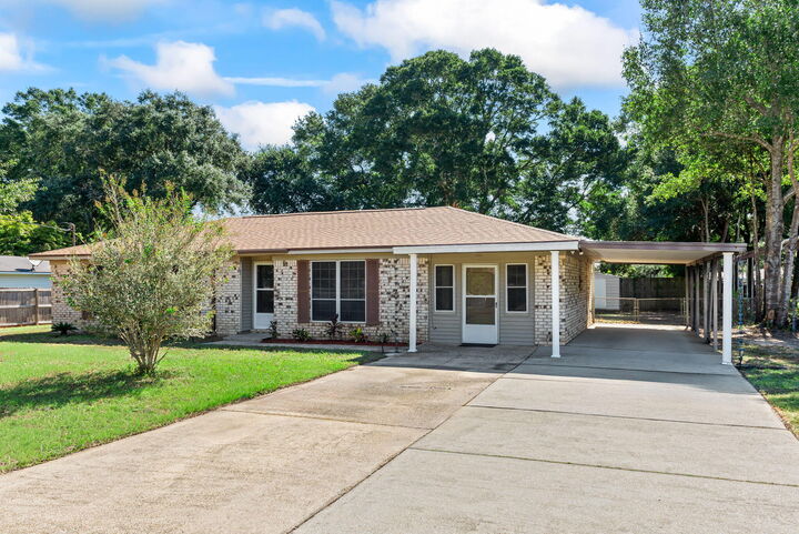 Property Photo:  5485 Mulat Road  FL 32583 