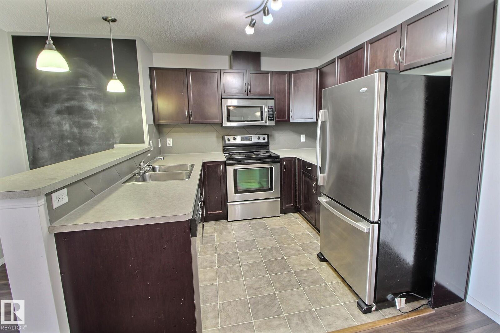 Property Photo: 5951 165 Avenue NW 205 AB T5Y 0J6